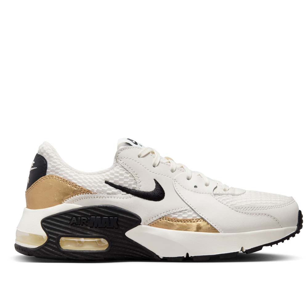 Nike women's black and best sale gold shoes